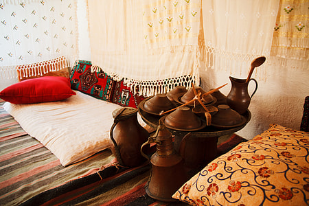 brown steel bowls and kettles on multicolored stripe rug thumbnail