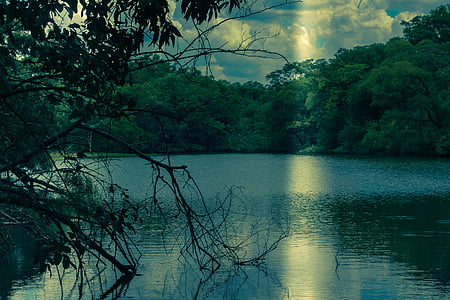 body of water under blue skies thumbnail