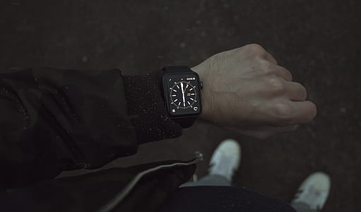 man looking at his smartwatch thumbnail