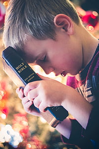 boy holding Holy Bible thumbnail
