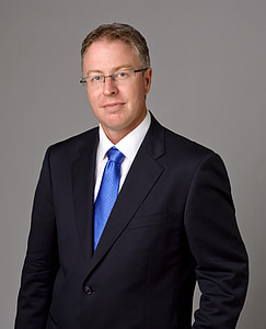 man wearing black notched lapel suit jacket thumbnail