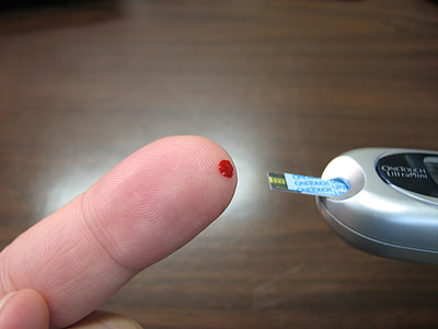 person checking a blood sugar thumbnail