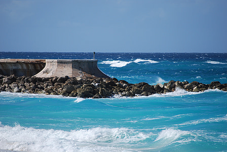 gray concrete dock on the ocean thumbnail