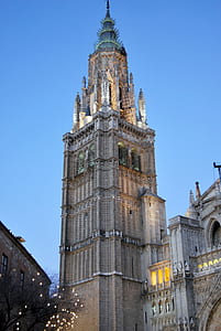 grey and beige concrete tower under blue sky thumbnail