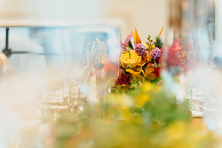 selective focus photo of yellow and purple petaled flower arrangement thumbnail