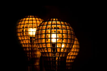 three brown lamps on black surface thumbnail