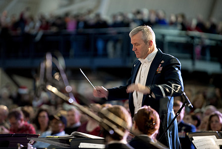 shallow focus photo of man in formal suit doing conducting thumbnail