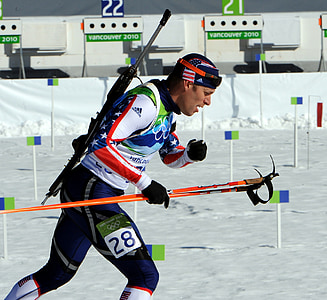 man wearing ice hockey suit and holding pole while running thumbnail