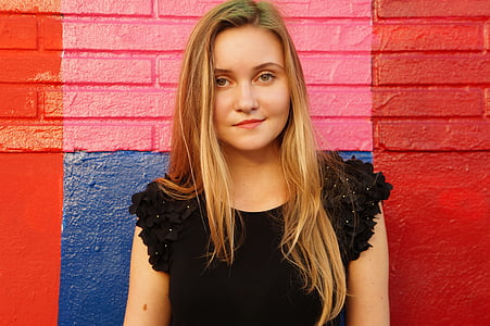 woman wearing black ruffled-sleeve top thumbnail