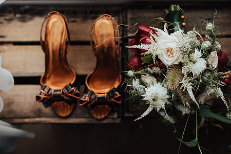 pair of women's brown heeled sandals on brown surface thumbnail