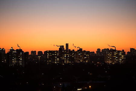 silhouette of high rise buildings during golden hour thumbnail