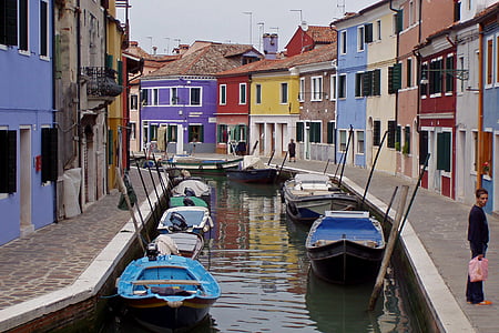 multicolored buildings with canal in the middle of the buildings thumbnail