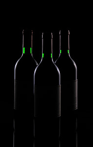three white bottles on black surface thumbnail