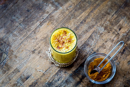 yellow liquid filled in glass beside powder filled in glass thumbnail