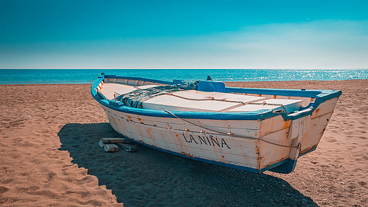 boat beside body of water thumbnail