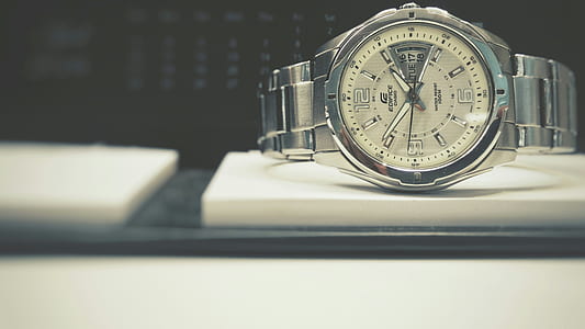 round white Edifice analog watch with silver-colored link band displaying 2:51 thumbnail