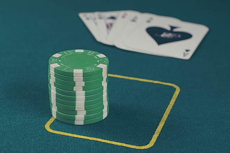 selective focus photography of green poker chips thumbnail