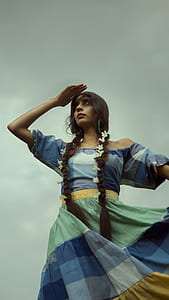 woman in blue and green off-shoulder dress thumbnail