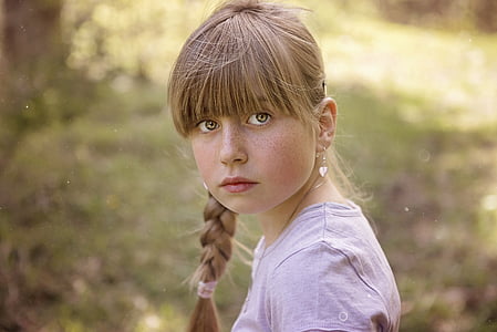 woman wearing purple shirt with braided hair thumbnail