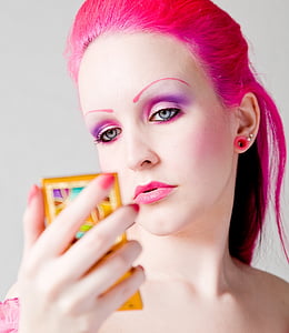 woman holding rectangular yellow case thumbnail