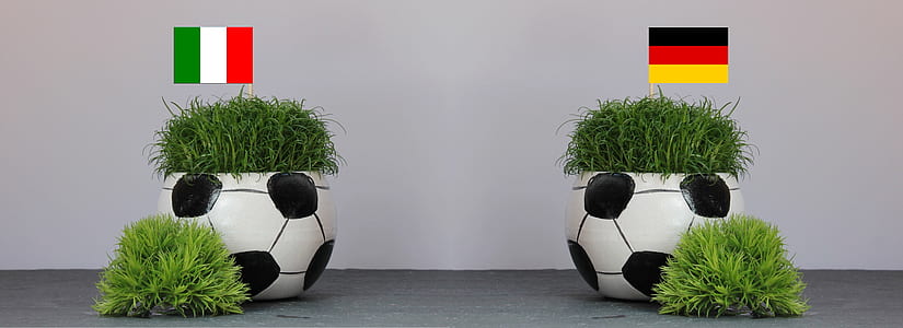 two soccer ball garden pots with Brazil and England flags thumbnail