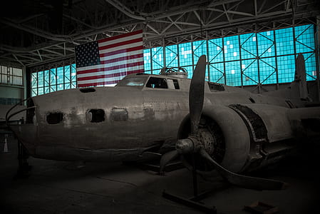 abandoned gray airplane inside building thumbnail