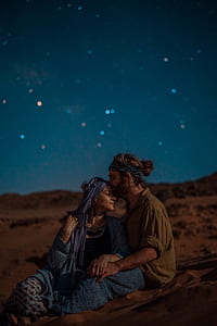 man kissing woman's forehead thumbnail