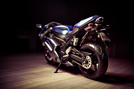 selective focus photo of black and blue sports bike thumbnail
