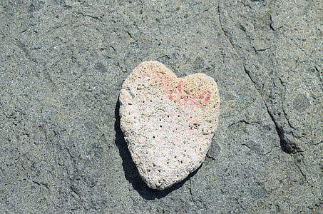 heart-shaped white stone on gray surface thumbnail