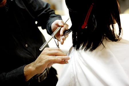 woman holding scissor thumbnail