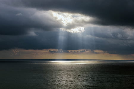 photo of ocean with crepuscular rays thumbnail