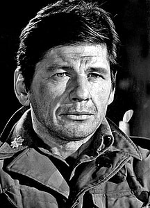 man wearing collared field jacket grayscale photography thumbnail