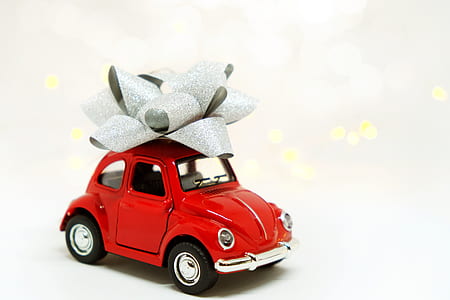 red Volkswagen Beetle coupe scale model with gray lace ribbon thumbnail