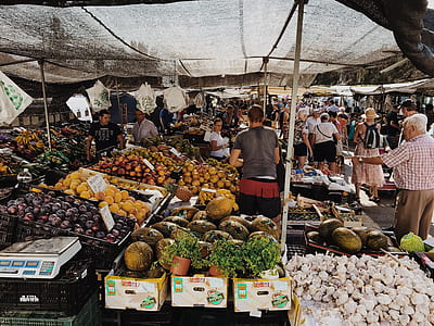 group of people on market during daytime thumbnail