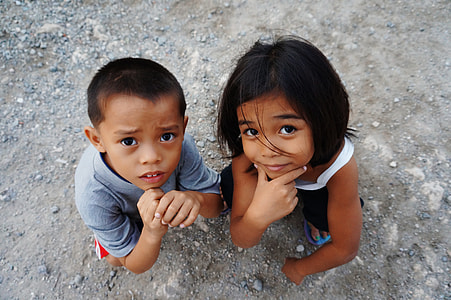 boy sitting beside girl squatting thumbnail