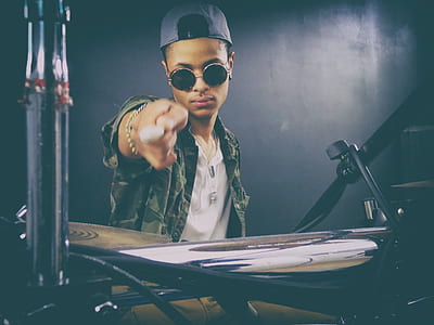 man holding drumstick pointing on the camera thumbnail