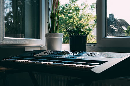 Black Electronic Keyboard Near Window thumbnail