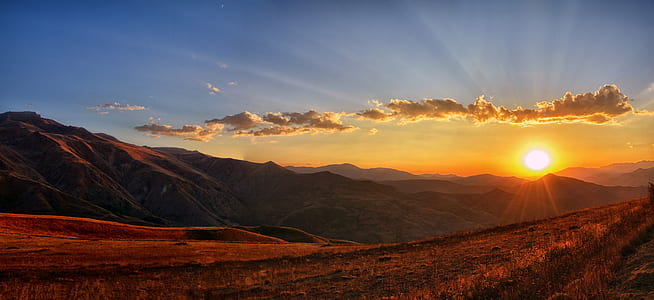 landscape photo of mountains during daytime thumbnail