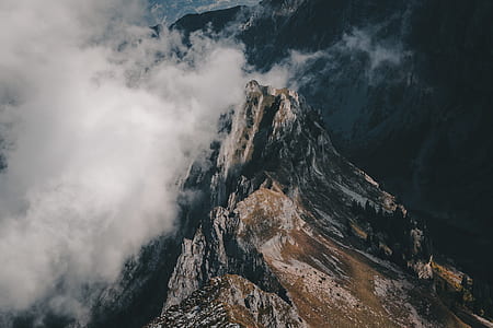 brown and gray mountain under white clouds thumbnail