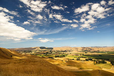 mountains under blue and white sky thumbnail