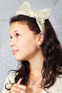 woman in silver star pendant necklace and earrings holding white umbrella thumbnail