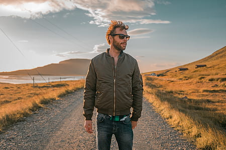 man standing near mountain thumbnail