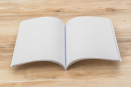 book page on beige wooden surface thumbnail