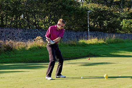 man playing golf at daytime thumbnail