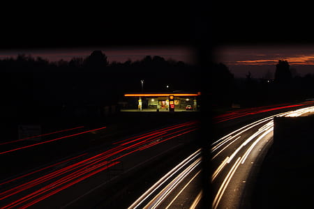 timelapse photo of cars cruising on road at night thumbnail