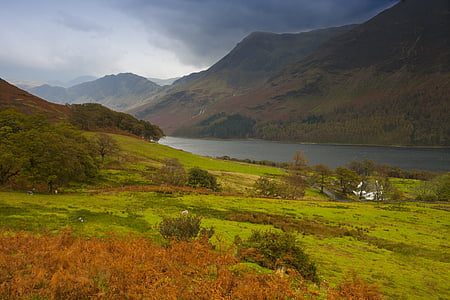mountains near body of water during daytime thumbnail
