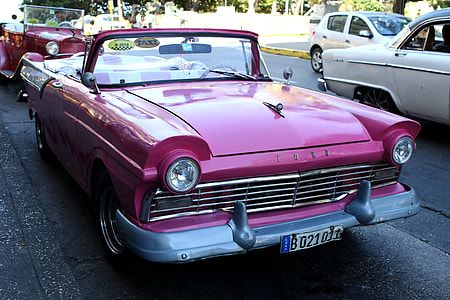purple Ford convertible coupe parked on road thumbnail