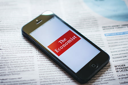 turned-on black iPhone 5 displaying The Economist thumbnail