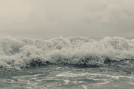 gray ocean wave under gray sky thumbnail