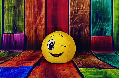 yellow emoji on multicolored wood parquet graphic wallpaper thumbnail